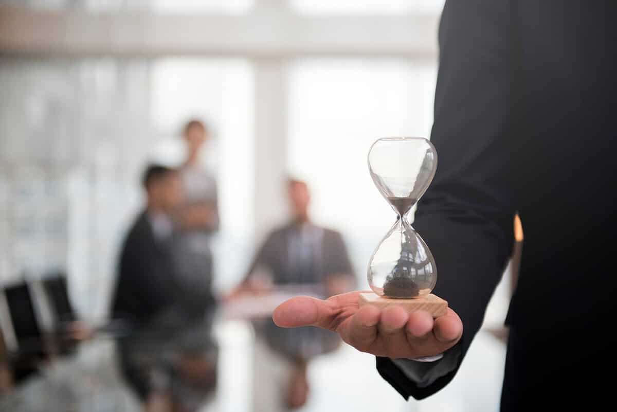 businessman-holding-hour-glass-signifies-importance-being-time-SMALL - Poliklinika Medikol